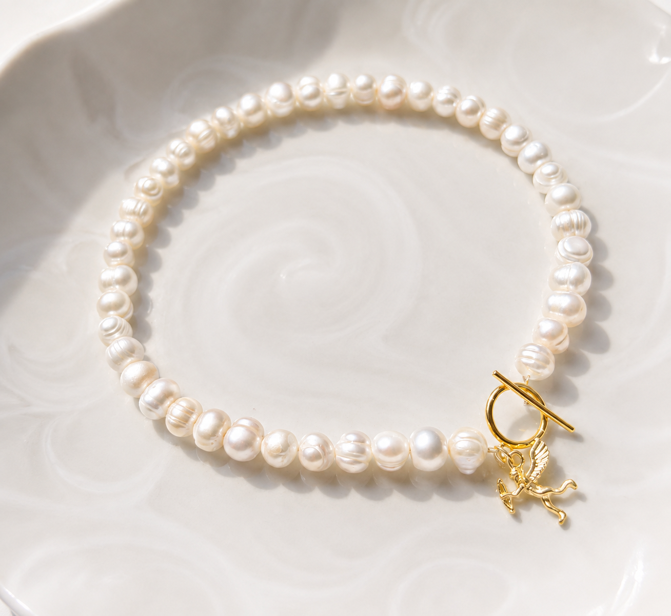 White pearl charm necklace with dainty gold Cupid / cherub charm, classic white pearl jewelry, unique pearl jewelry, summer jewelry