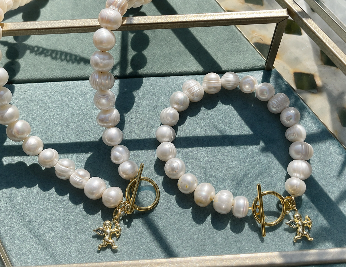 White pearl charm necklace with dainty gold Cupid / cherub charm, classic white pearl jewelry, unique pearl jewelry, summer jewelry