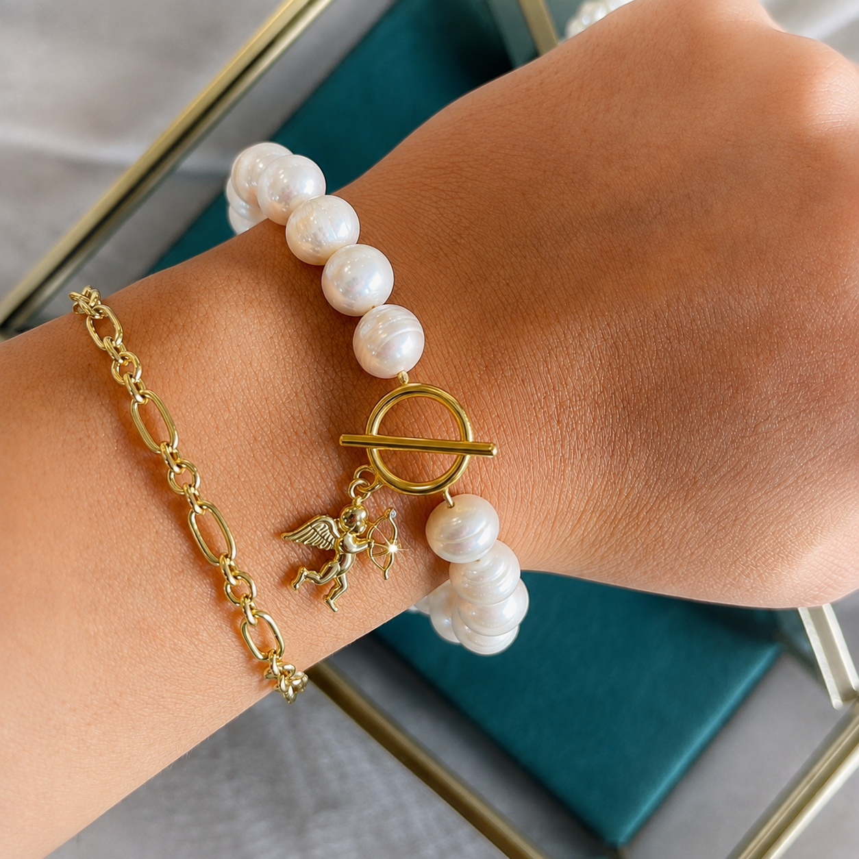 White pearl charm bracelet with dainty gold Cupid / cherub charm, classic white pearl jewelry, unique pearl jewelry, summer jewelry
