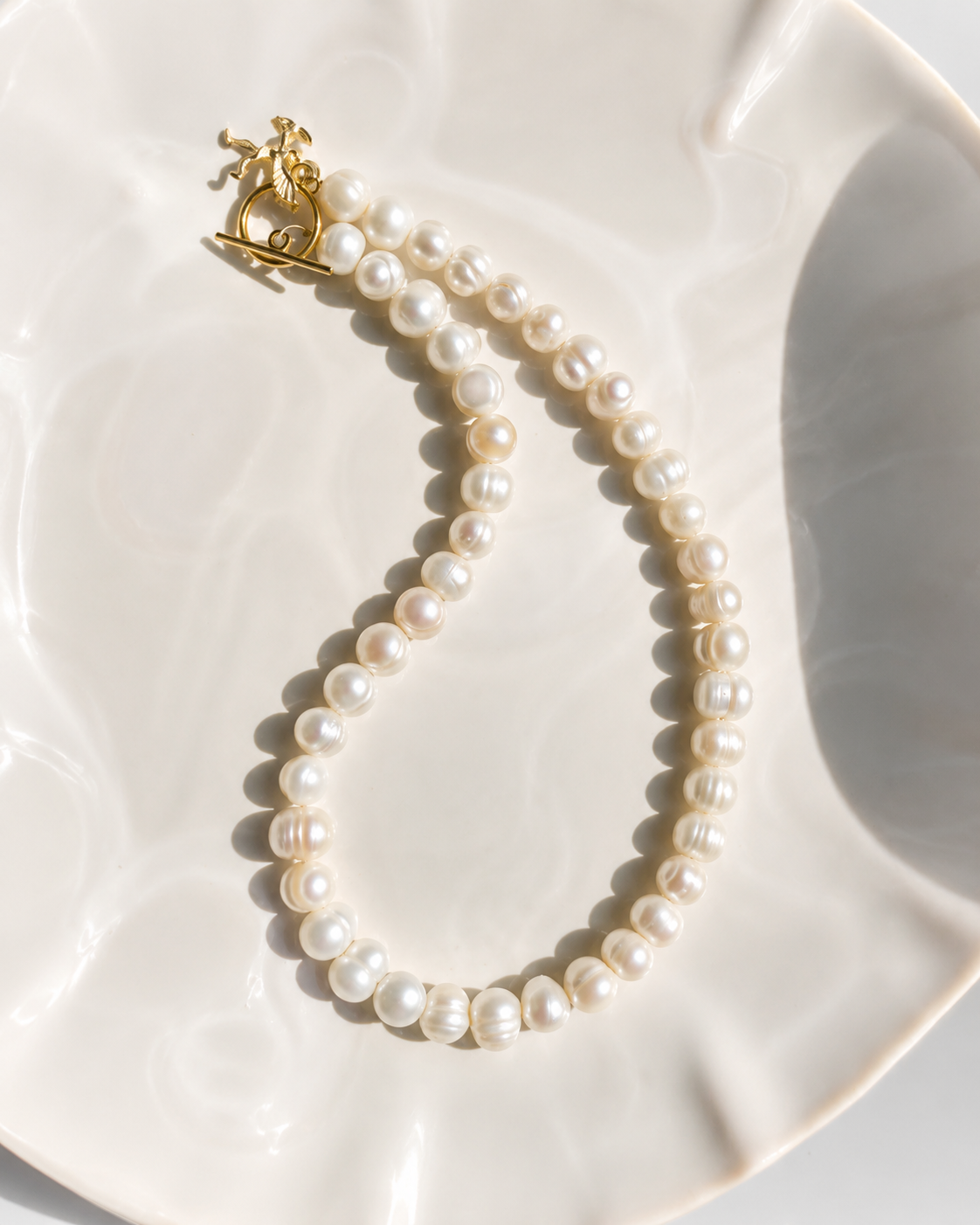 White pearl charm necklace with dainty gold Cupid / cherub charm, classic white pearl jewelry, unique pearl jewelry, summer jewelry