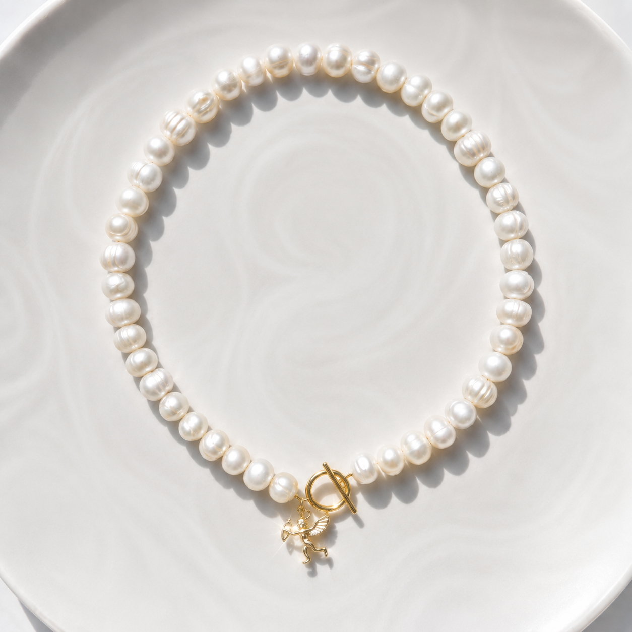 White pearl charm necklace with dainty gold Cupid / cherub charm, classic white pearl jewelry, unique pearl jewelry, summer jewelry