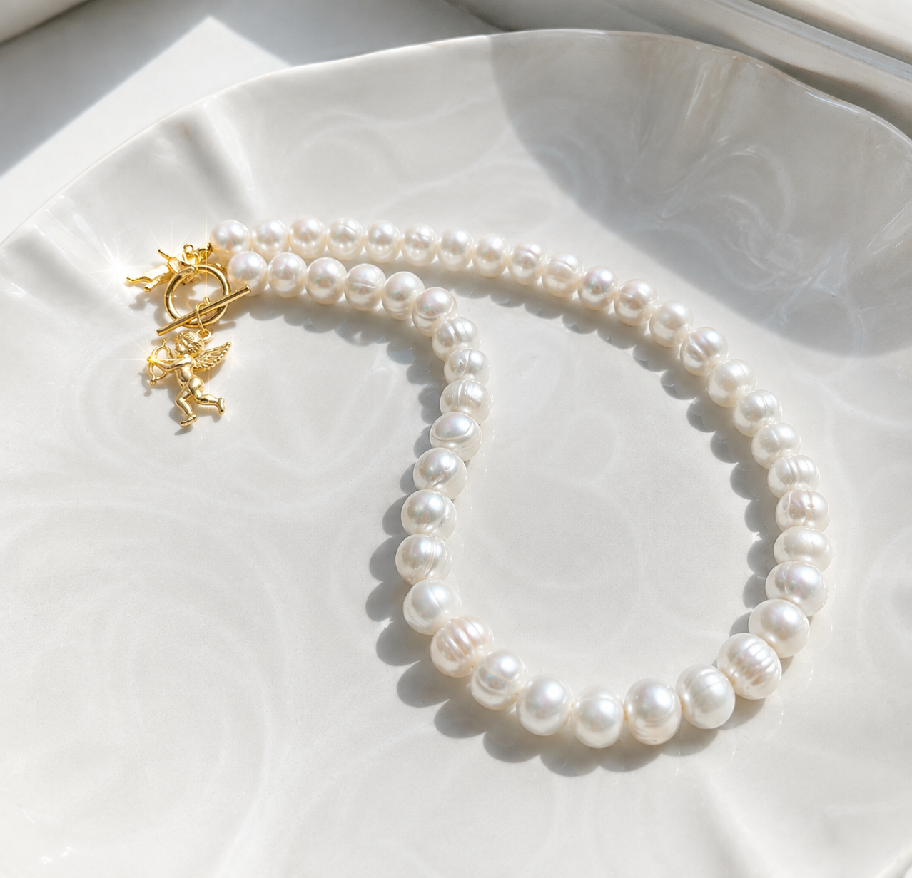 White pearl charm necklace with dainty gold Cupid / cherub charm, classic white pearl jewelry, unique pearl jewelry, summer jewelry