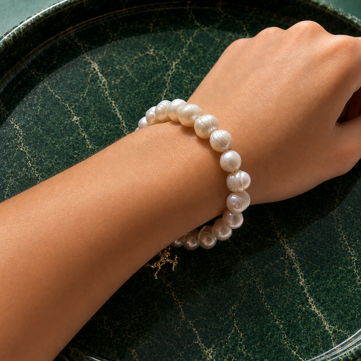 White pearl charm bracelet with dainty gold Cupid / cherub charm, classic white pearl jewelry, unique pearl jewelry, summer jewelry