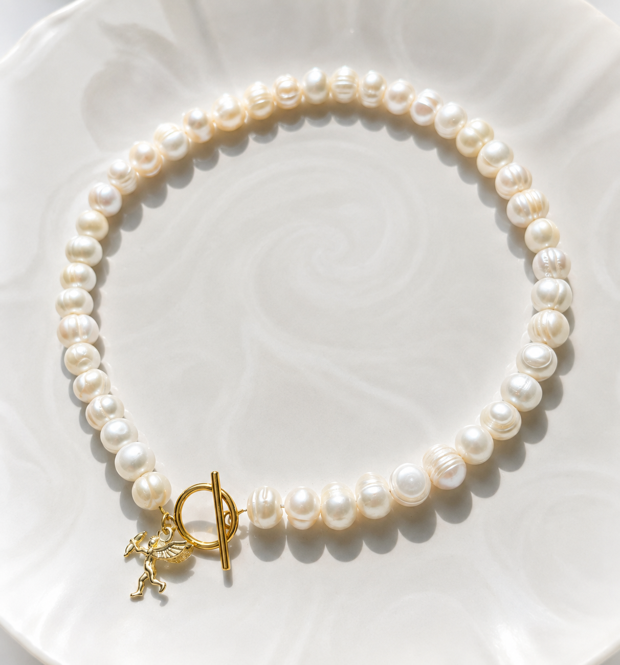 White pearl charm necklace with dainty gold Cupid / cherub charm, classic white pearl jewelry, unique pearl jewelry, summer jewelry