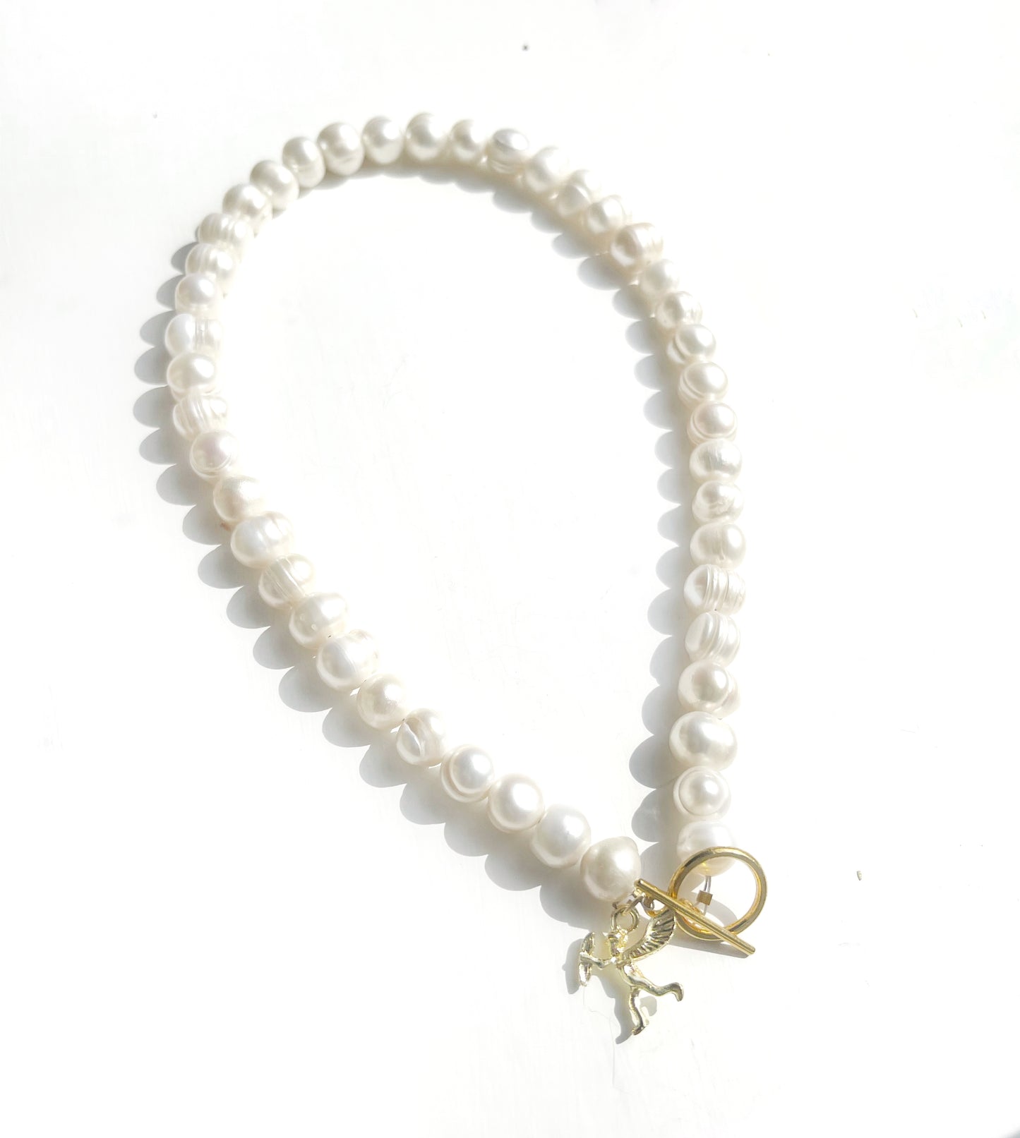 White pearl charm necklace with dainty gold Cupid / cherub charm, classic white pearl jewelry, unique pearl jewelry, summer jewelry